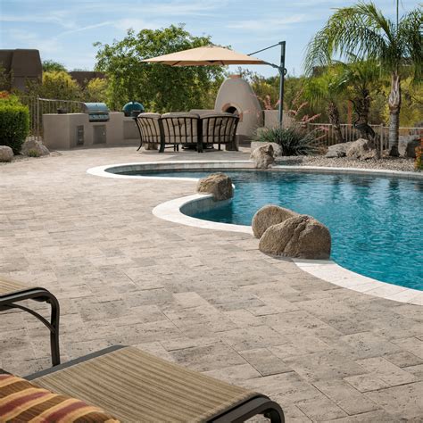 What is an alternative to travertine around a pool?