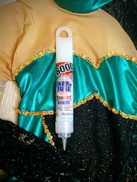 What is the best glue for rhinestones on clothes?