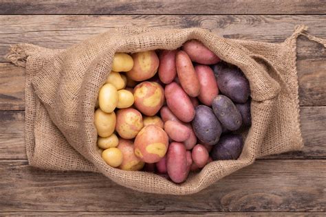 What is the best way to store potatoes and sweet potatoes?