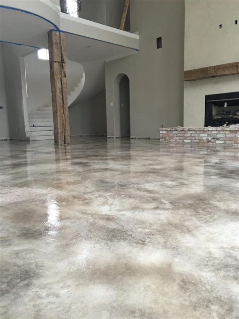 What is the cheapest way to finish a concrete floor?