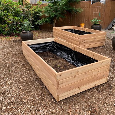 What is the cheapest wood for raised garden beds?