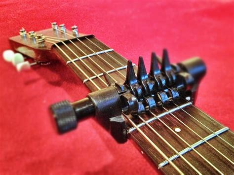 What is the difference between a capo and an alternate tuning?