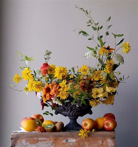 What is the difference between floral design and flower arrangement?