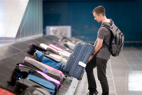 What is the minimum layover time for checked bags?