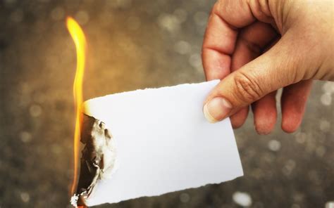 What is the safest way to burn a piece of paper?