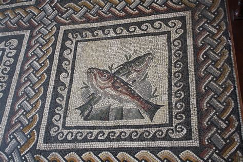 What materials did Roman artists create mosaics out of?