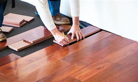 What must occur before wood flooring installation?