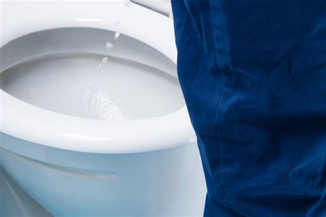 What percentage of men pee standing up?