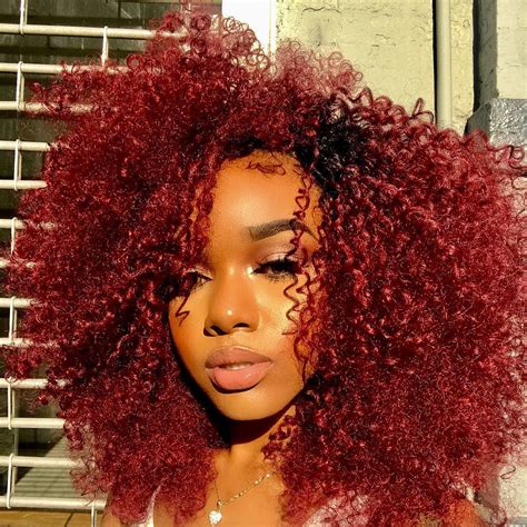 What red hair dye shows on black hair?