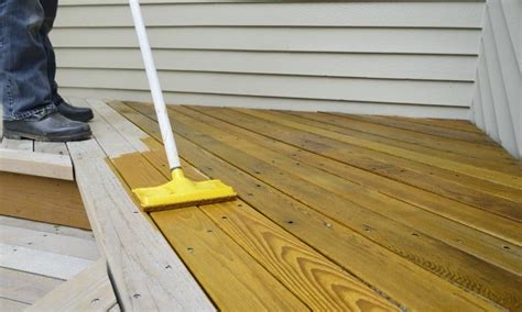 What temperature is too hot to stain a deck?