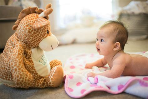 When can babies hold their head up?