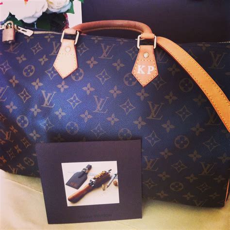 When did Louis Vuitton start stamping bags?