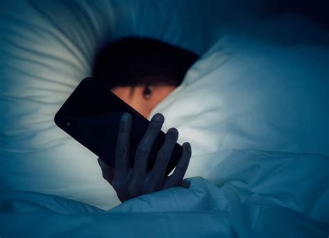 When should I stop looking at my phone before bed?