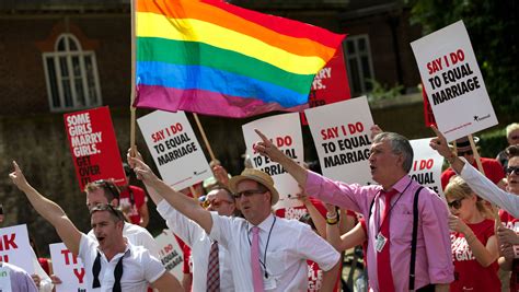 When was homosexuality legalized in the UK?