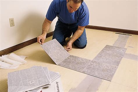Where do you start when laying vinyl floor tiles?