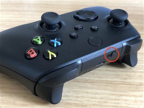 Where is the pair button on the controller?