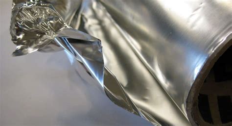Which side of aluminum foil should touch the food?