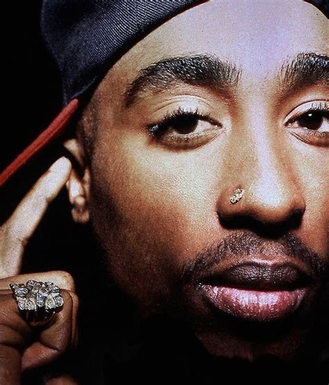 Which side of the nose did Tupac Pierce?