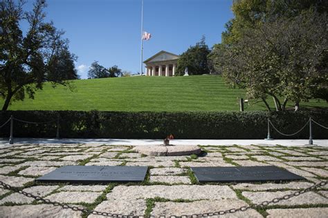 Who is buried next to JFK?
