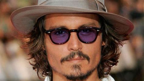 Why are Johnny Depp's glasses dark?