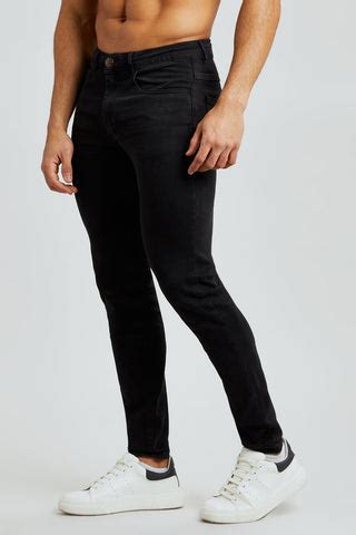 Why are black jeans tighter?