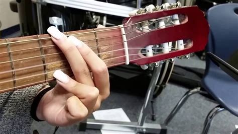 Why can't I play guitar with long nails?