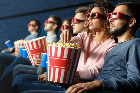 Why did people start eating popcorn at movies?