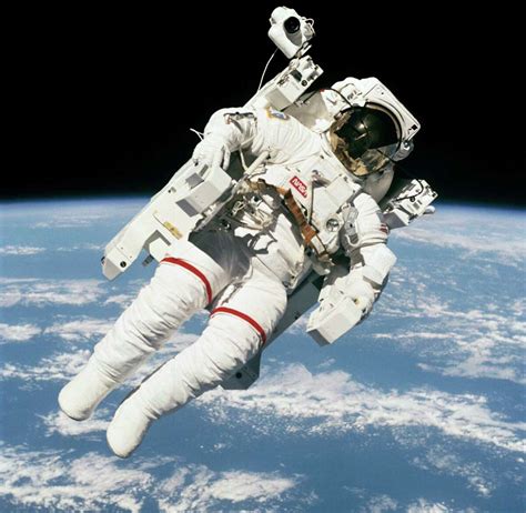 Why do astronauts wear shiny suits for space walks?