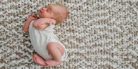 Why do babies throw their head back?