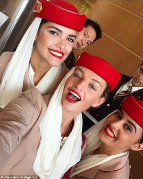 Why do female flight attendants wear red lipstick?