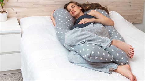 Why do females sleep with a pillow in between their legs?