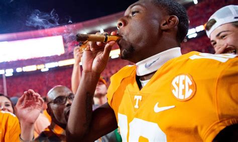 Why do football players smoke cigars after winning?