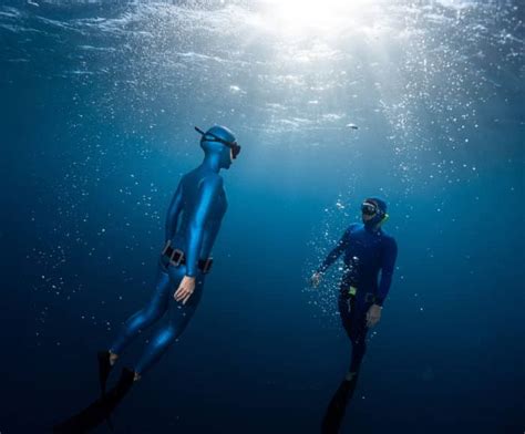 Why do freedivers pinch their nose?