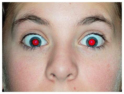 Why do human eyes glow red in the dark?