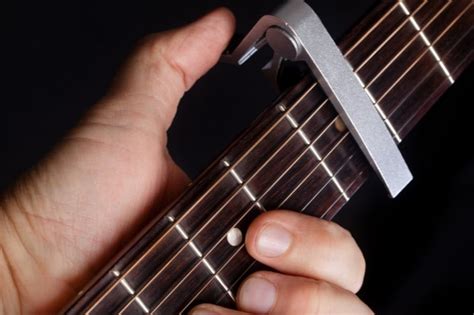 Why do musicians use capos?