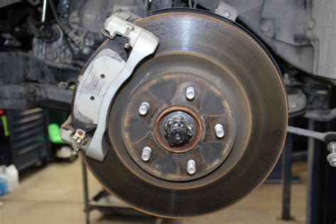 Why do my brakes feel soft after new pads and discs?