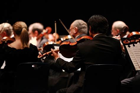 Why do orchestras wear black?
