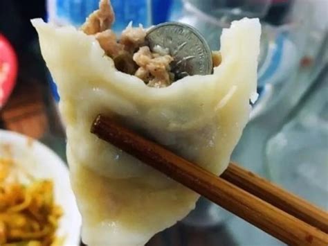 Why do people put coins in dumplings?