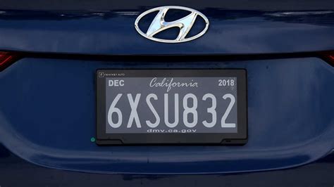 Why do some cars in California not have a front license plate?