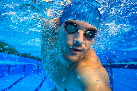 Why do swimmers wet their goggles?