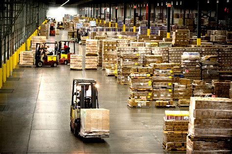 Why do warehouses hold stock?