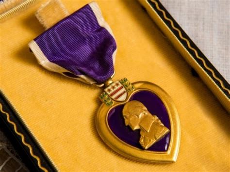 Why does JFK have a Purple Heart?