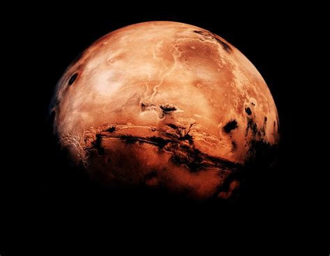 Why does Mars glow orange?