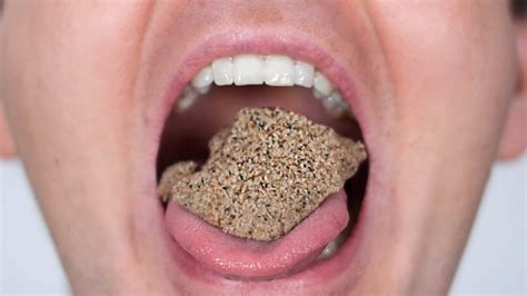 Why does it feel like grains of sand in my mouth?