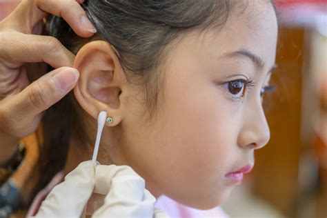 Why does my daughter's ear piercing keep getting infected?