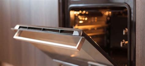 Why does my oven smell funny after cleaning?