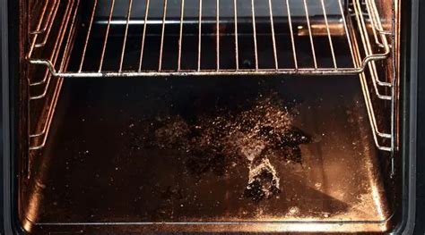 Why does my oven smell like chemicals?