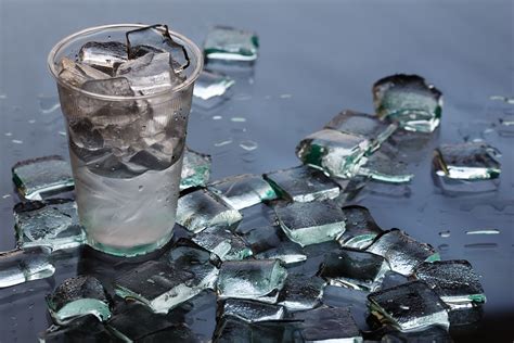 Why does vodka melt ice so fast?