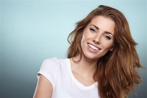 Why is a woman's smile attractive?