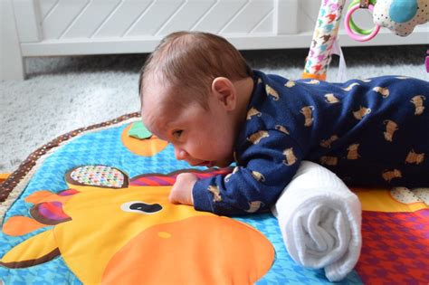 Why is my 2 month old not lifting his head during tummy time?